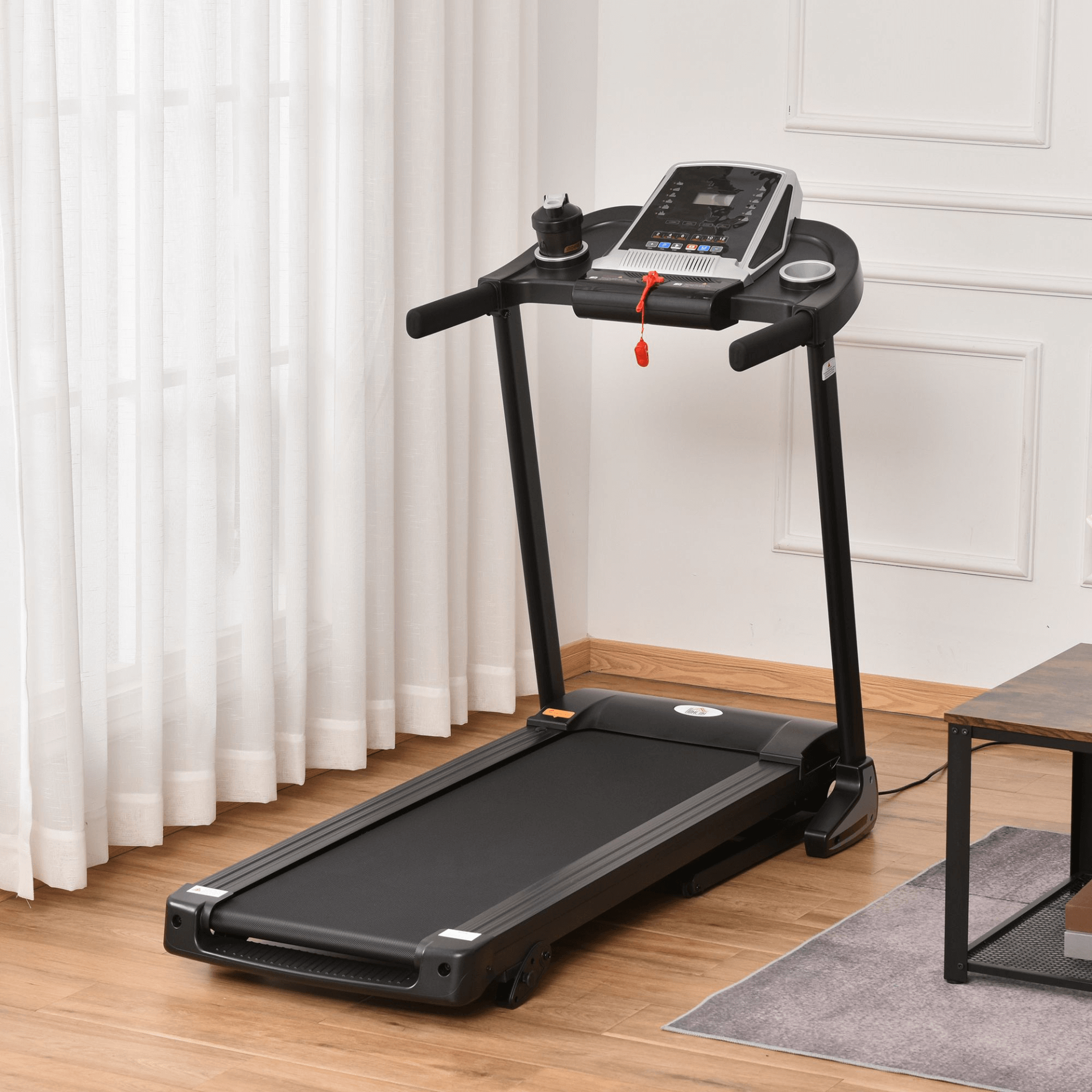 Folding Electric Treadmill - 2.0HP, 12 km/h, Black, Enhance your home workouts with our Folding Electric Treadmill. Features 2.0HP motor, 12 km/h speed & 12 programs. Ideal for fitness enthusiasts.