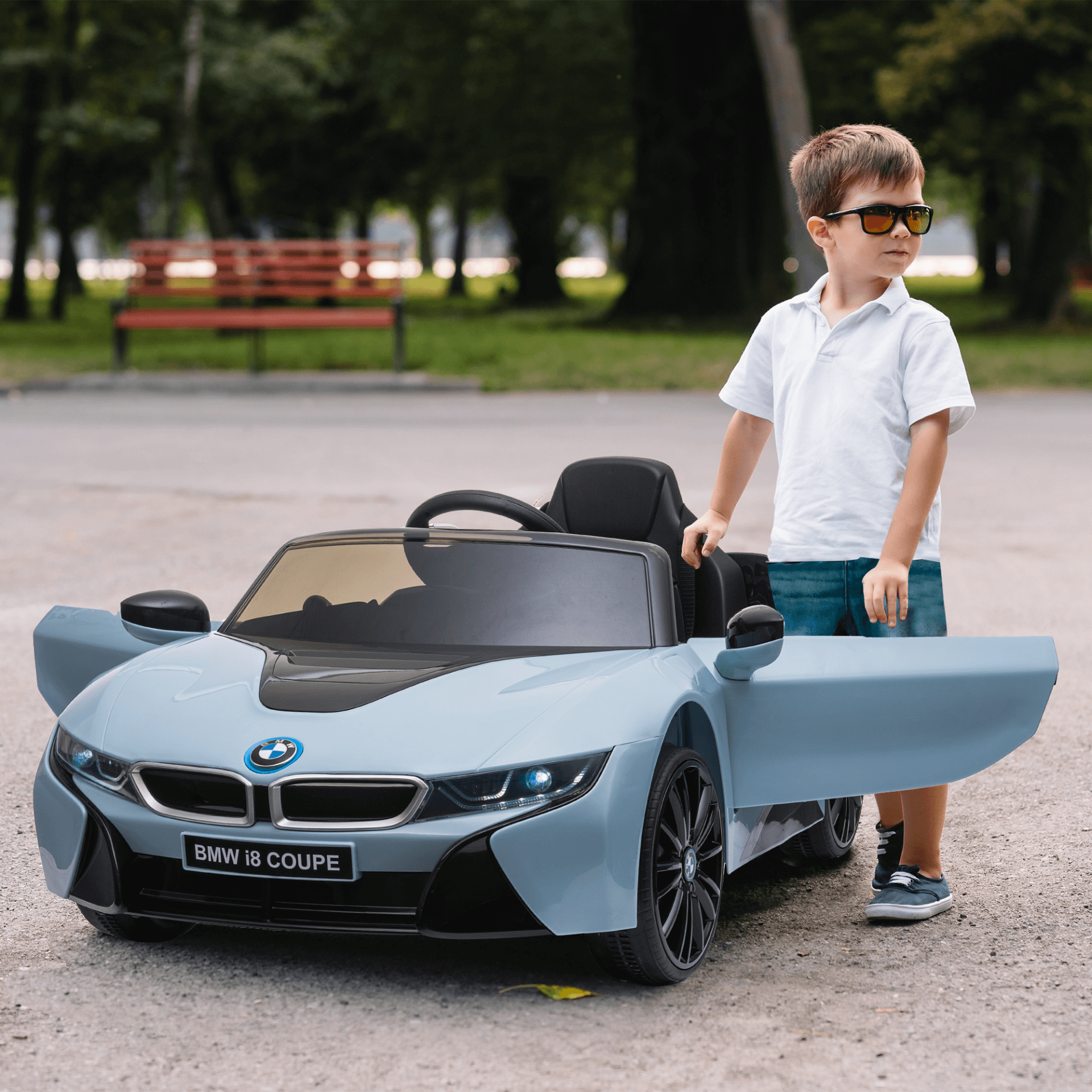 Blue BMW I8 Kids Ride On Car 6V - Electric Toy, Get your kids the thrill of the road with a BMW I8 Coupe Electric Ride On. A safe, adventurous ride perfect for 3-8 years. Sleek design & secure fun.