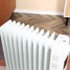 HOMCOM 2720W Oil Filled Radiator - 11 Fin Electric Heater, Stay warm with the HOMCOM 2720W heater featuring a timer, remote control, and safety features for ultimate comfort this winter.