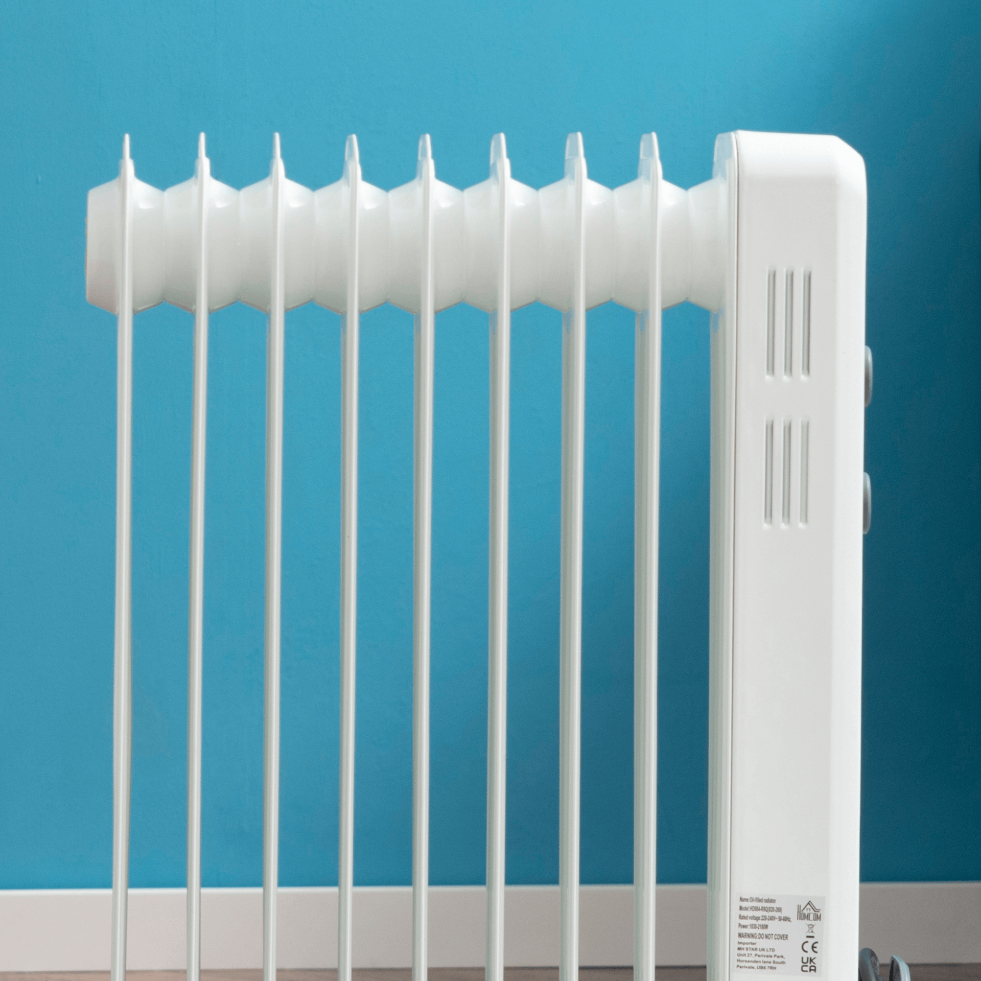 Oil Filled Radiator - Portable Electric Heater, Stay warm with an oil-filled radiator featuring an adjustable thermostat and 3 heat settings. Perfect for any room size and enhanced with safety features.