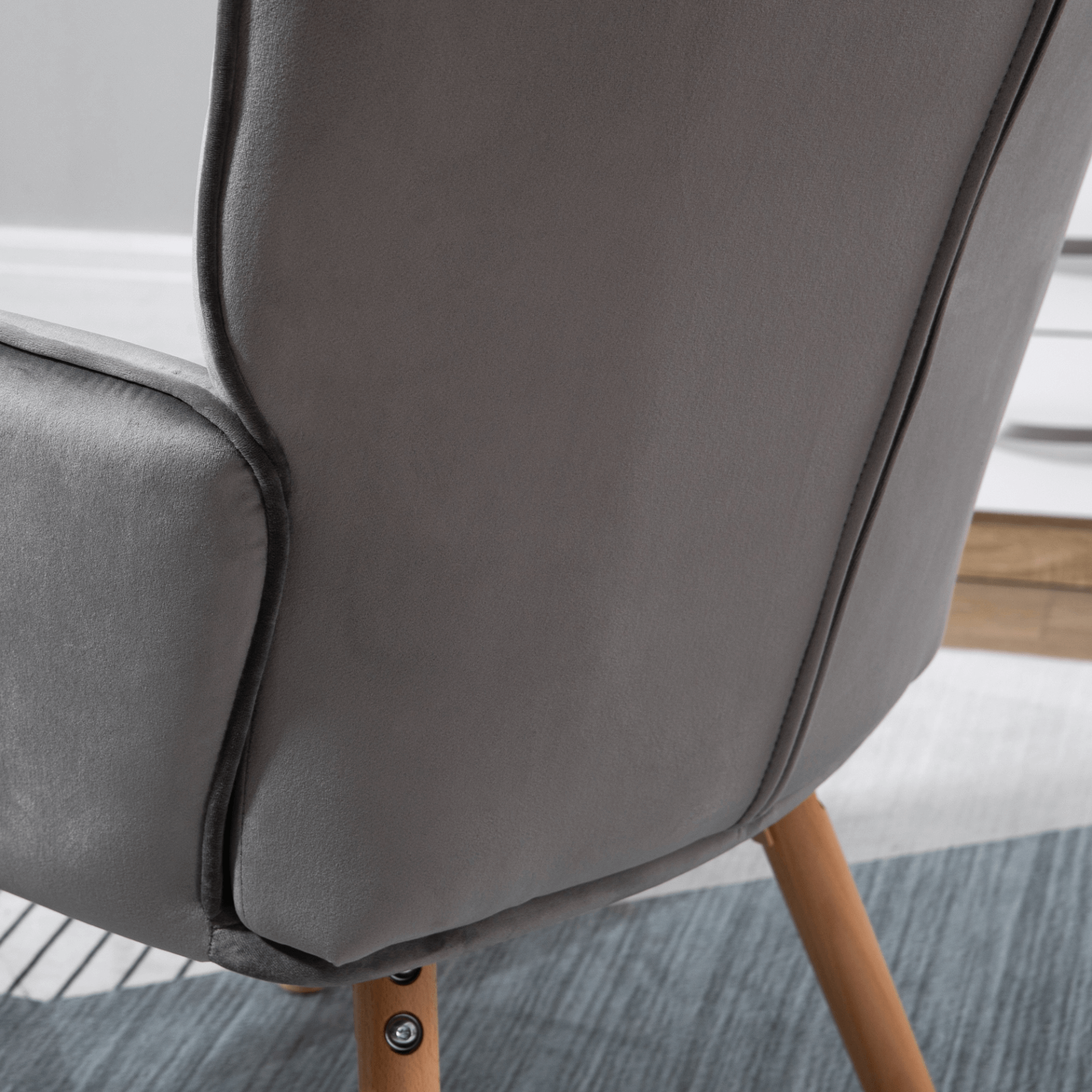 Modern Velvet Tufted Wingback Armchair - Grey, Elevate your space with our Modern Velvet Wingback Armchair. Luxurious tufted design, superior comfort with high-density padding, and durable wooden legs.