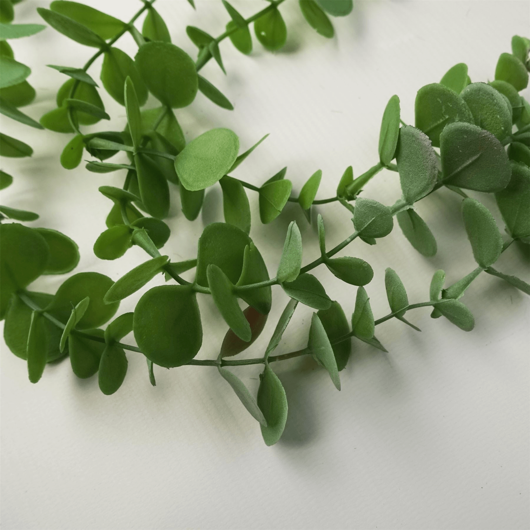 Lifelike Eucalyptus Plant Decor | Leaf Design UK, Transform any space with our realistic Eucalyptus Trailing Plant. Perfect for homes & events, maintenance-free.