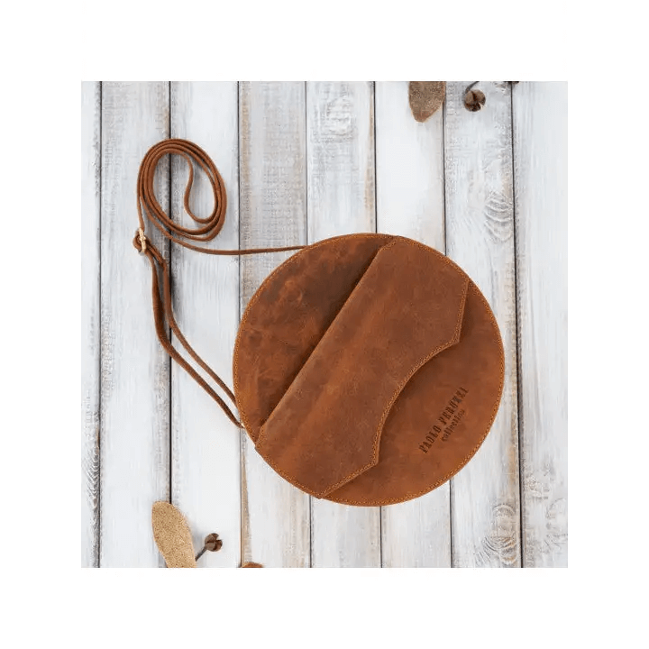 Vintage Round Leather Handbag - Classic Style Discover elegance with our Round Leather Handbag. Perfectly aged, offering ample storage and unisex design for any occasion.