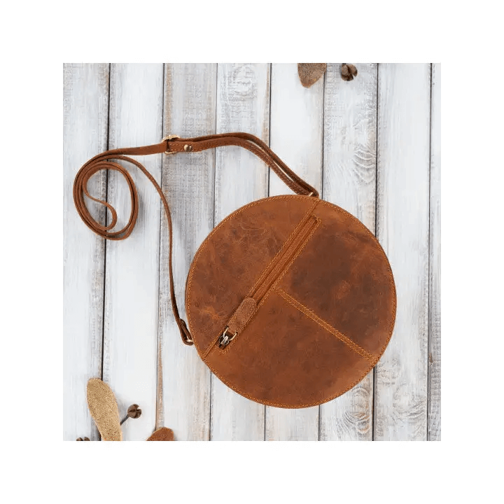 Vintage Round Leather Handbag - Classic Style Discover elegance with our Round Leather Handbag. Perfectly aged, offering ample storage and unisex design for any occasion.