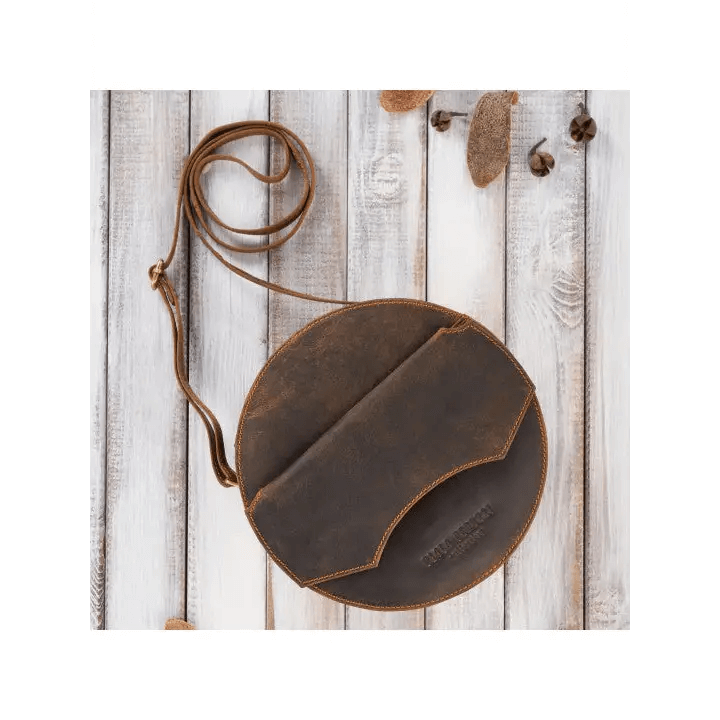 Vintage Round Leather Handbag - Classic Style Discover elegance with our Round Leather Handbag. Perfectly aged, offering ample storage and unisex design for any occasion.