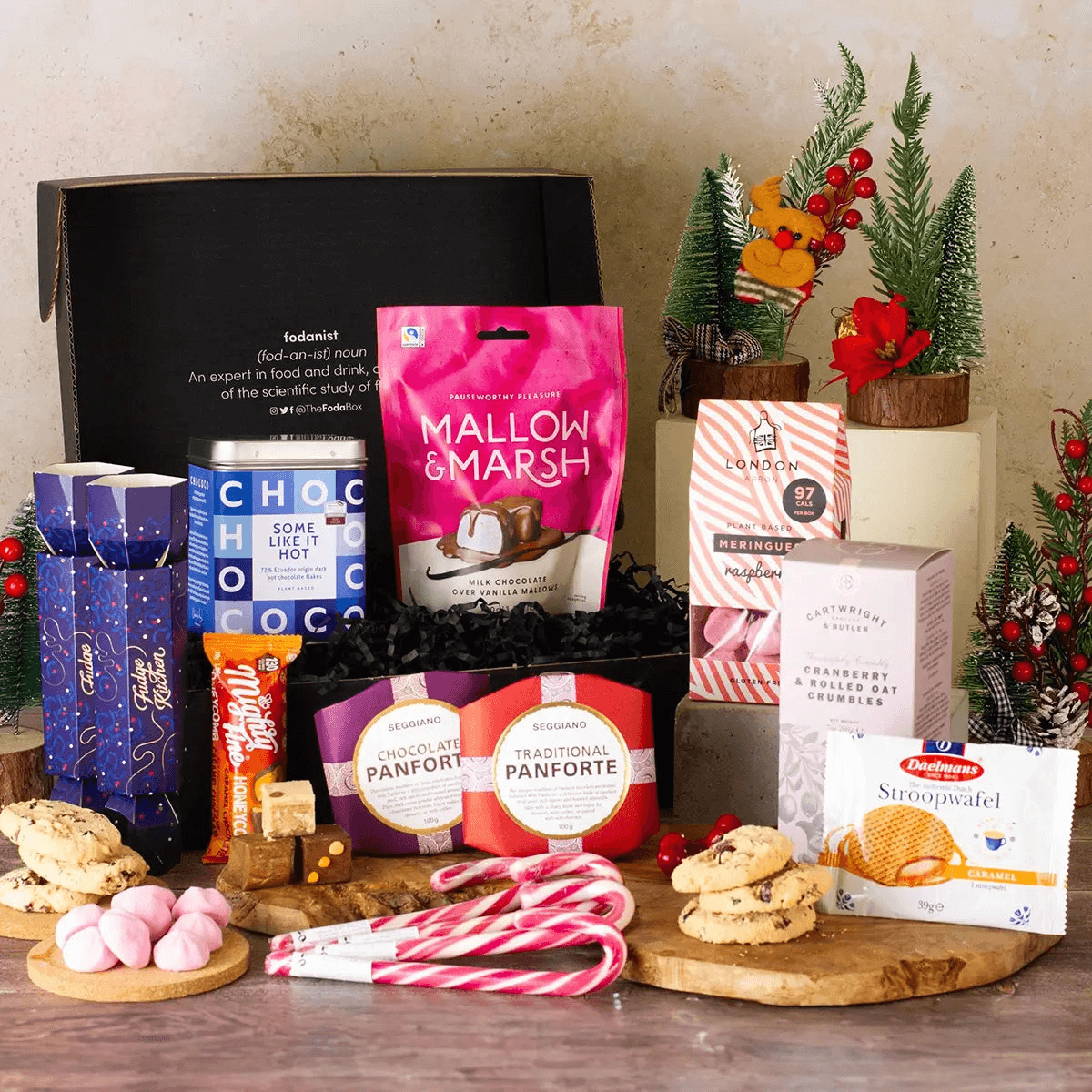 Winter Warmer Hot Chocolate Gift Box, Delight someone special with the Winter Warmer Hot Chocolate Gift Box, the ultimate cozy treat featuring rich chocolate flakes and mouth-watering fudge.