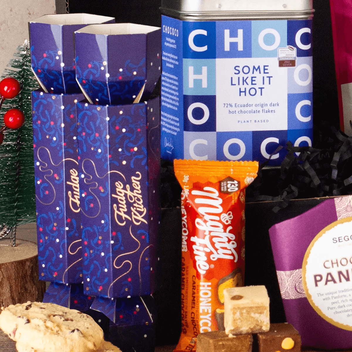 Winter Warmer Hot Chocolate Gift Box, Delight someone special with the Winter Warmer Hot Chocolate Gift Box, the ultimate cozy treat featuring rich chocolate flakes and mouth-watering fudge.