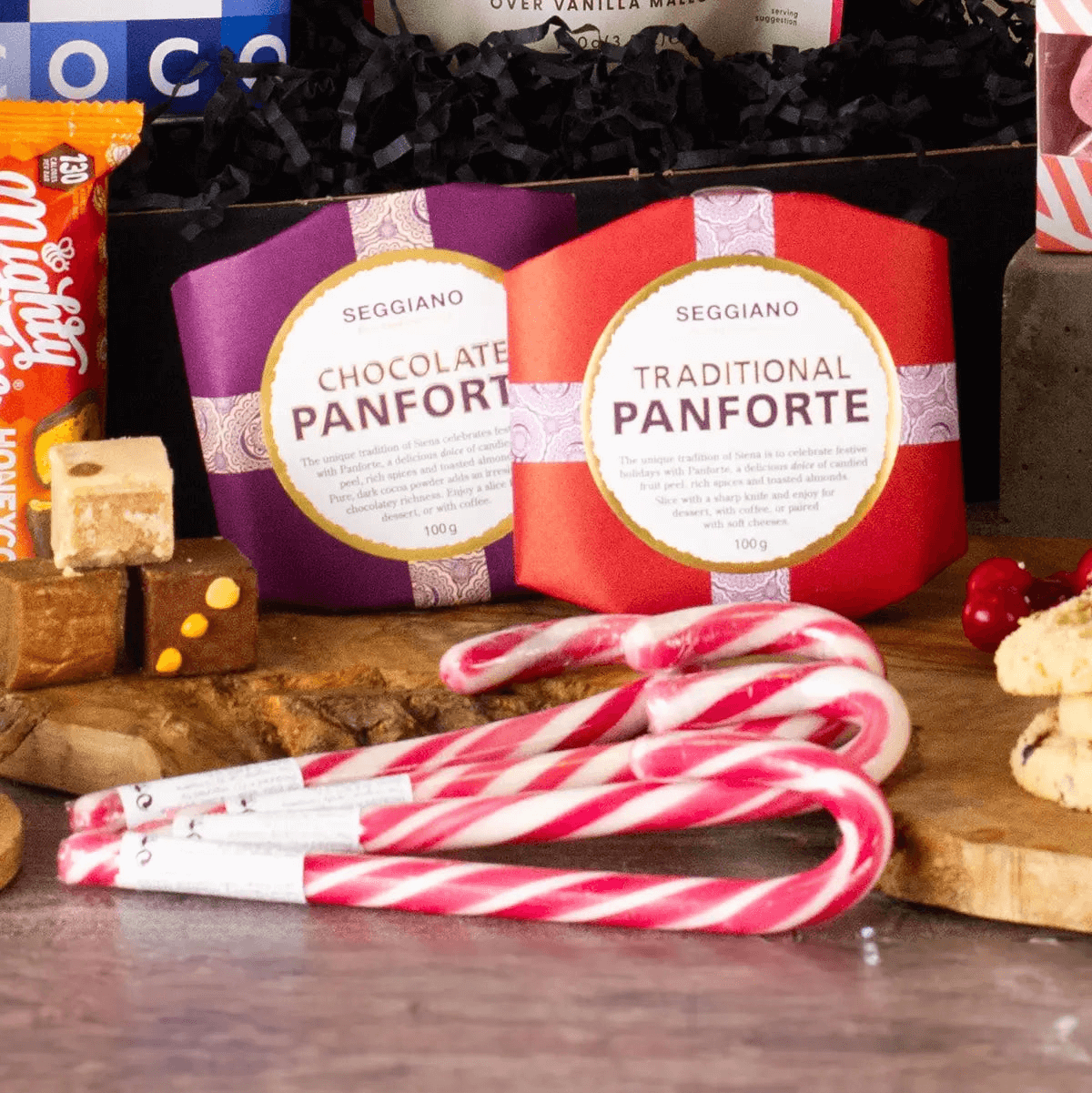 Winter Warmer Hot Chocolate Gift Box, Delight someone special with the Winter Warmer Hot Chocolate Gift Box, the ultimate cozy treat featuring rich chocolate flakes and mouth-watering fudge.