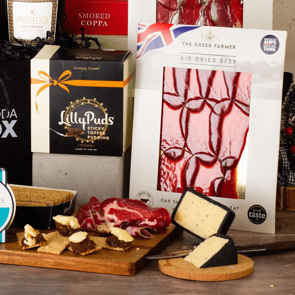 Luxury Christmas Wonders Gift Hamper, Discover festive cheer with gourmet treats, artisan cheese, and Prosecco. Perfect for joyful celebrations! Ideal festive gift solution.