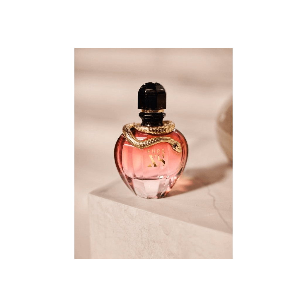 Captivating Paco Rabanne Pure XS Her Eau De Parfum, Discover the exotic floral-oriental scent of Paco Rabanne Pure XS Her. Experience luxury with notes of popcorn and ylang-ylang.